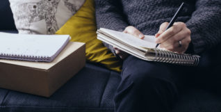 Man writing in notebook