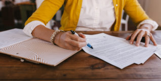 Woman at desk with notes