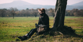 Man sitting under tree