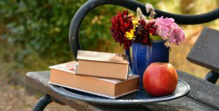 Books, apple, flowers, bench